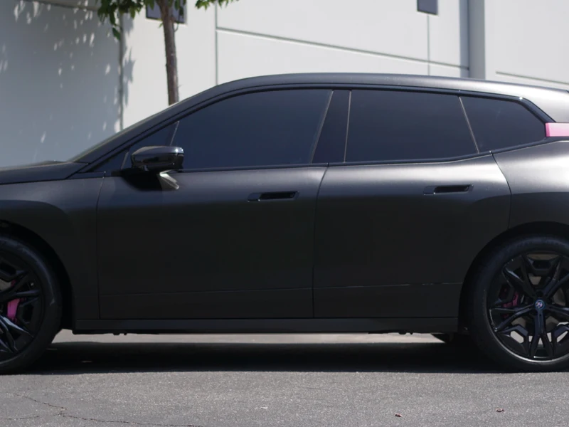 BMW iX Diamond Black Vinyl Wrap — photo 3 — Hussle Customz Los Angeles