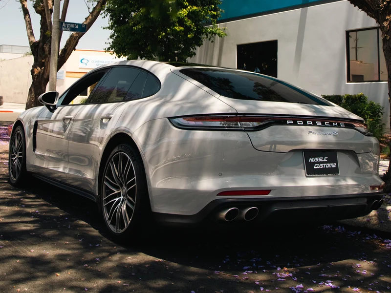 White Porsche Panamera rear three-quarter showing dark rear ceramic tint