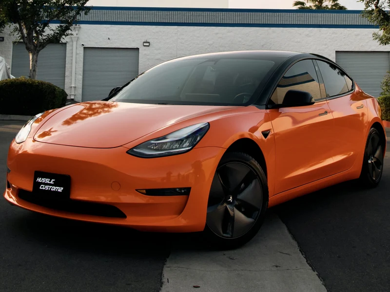 Tesla Model 3 — Gloss Orange Vinyl Wrap | Hussle Customz