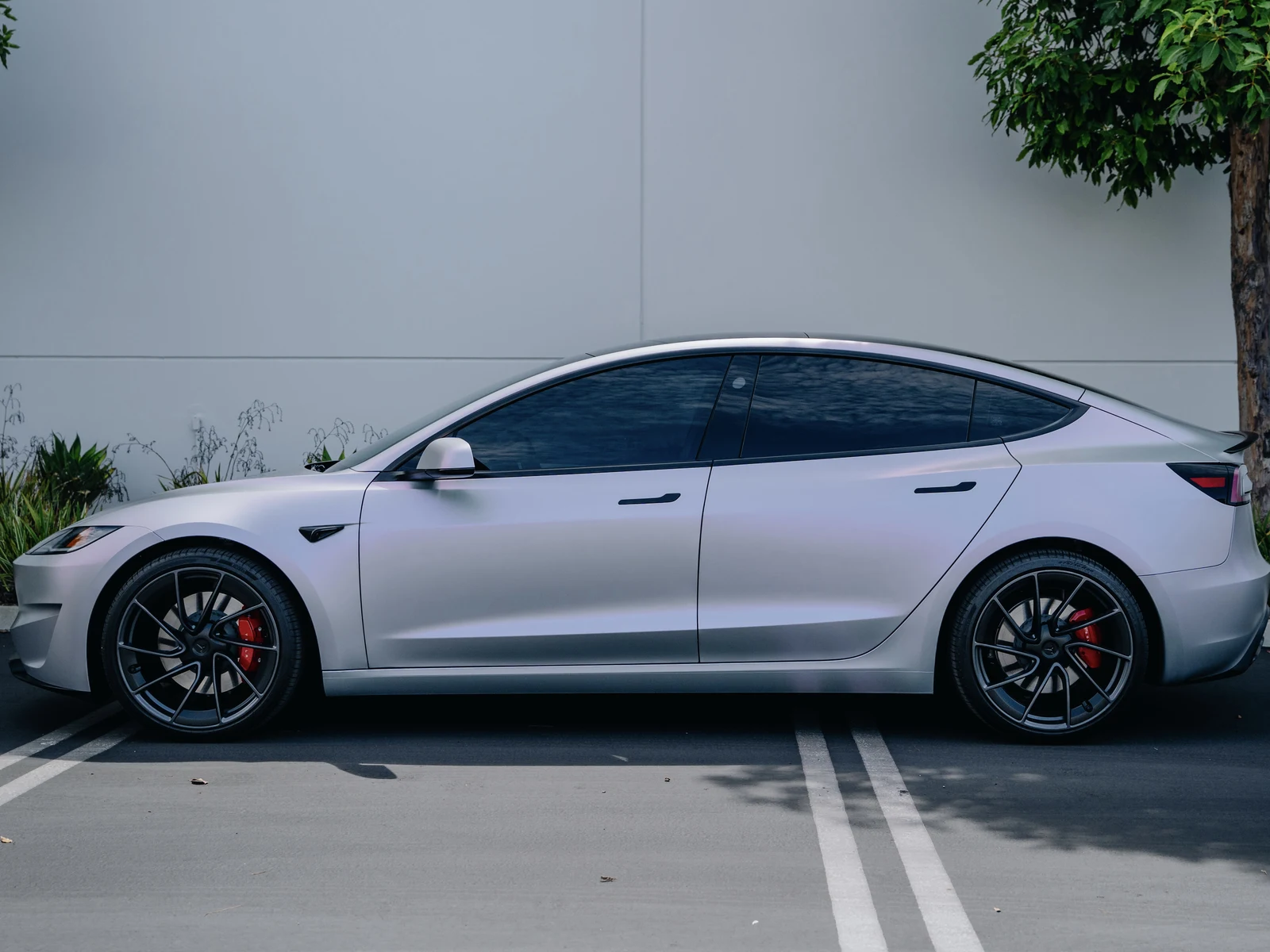 Tesla Model 3 Highland Platinum Pink Vinyl Wrap — photo 2 — Hussle Customz Los Angeles