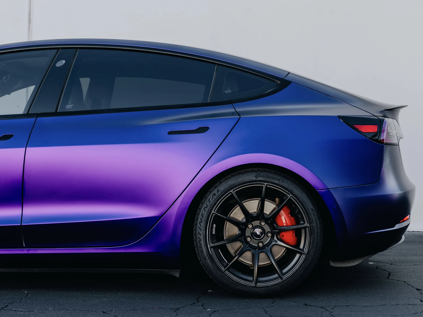 Tesla Model 3 Matte Purple Black Iridescent Wrap — photo 3 — Hussle Customz Los Angeles