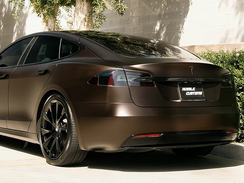 Tesla Model S chrome delete on window trim and door handles, close detail