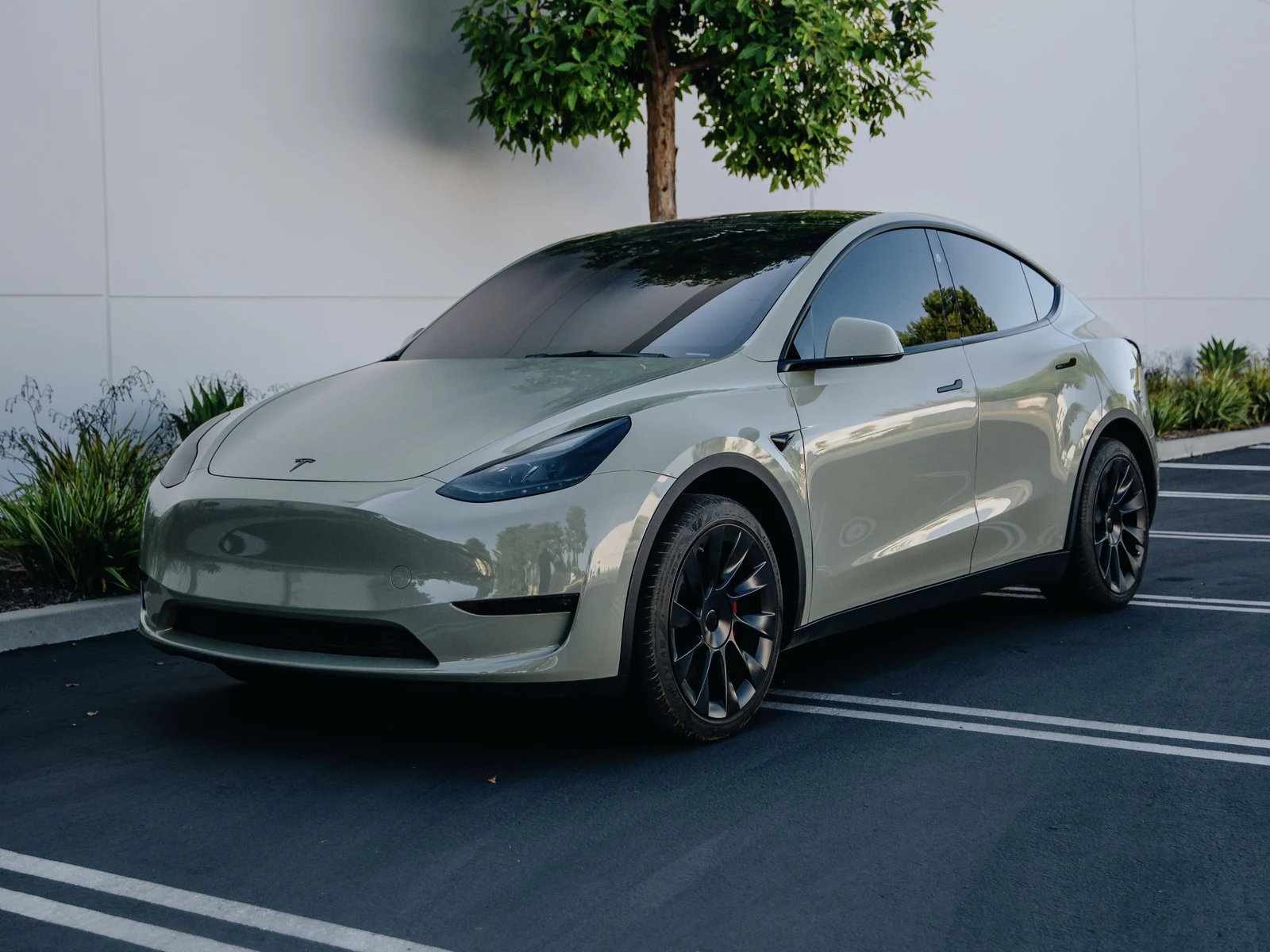 Tesla Model Y &mdash; Gloss Moss Green Wrap, Smoked Lights | Hussle Customz