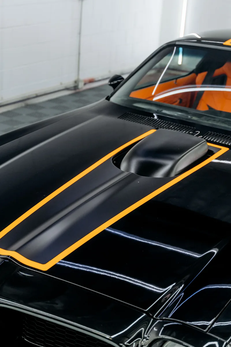 Satin black racing stripes with orange pinstripe outline on Pontiac Firebird — Hussle Customz Los Angeles